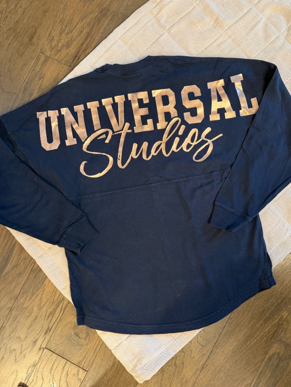 Universal Navy Blue Graphic Tee with Logo Tag
